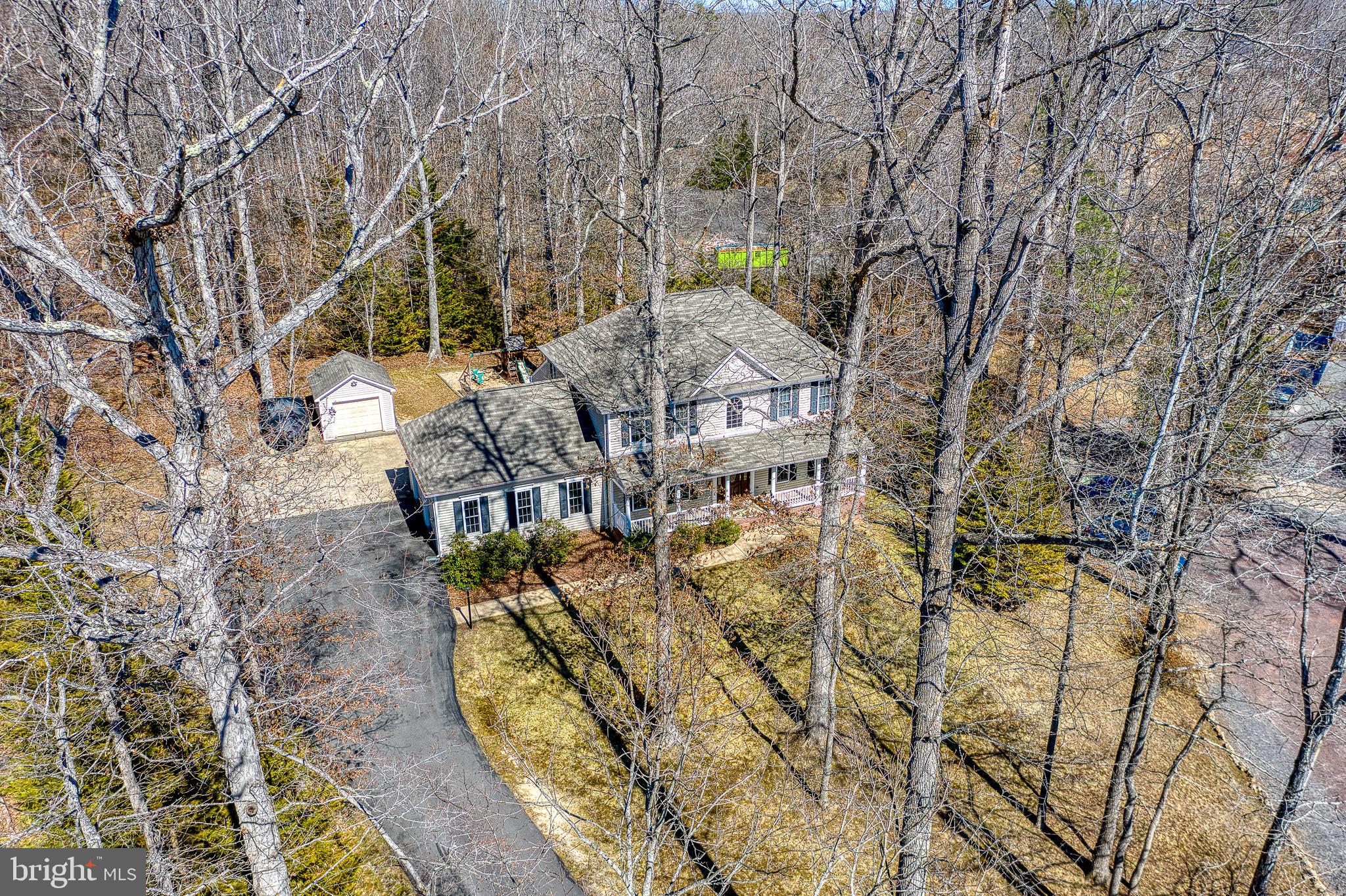101 Saylers Creek Road Locust Grove, VA 22508 - Photo 65 of 81 an aerial view of a house with swimming pool and large trees