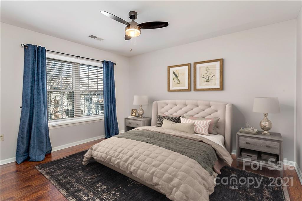 5011 Sharon Road, Unit E Charlotte, NC 28210 - Photo 11 of 19 a bedroom with a bed and a window