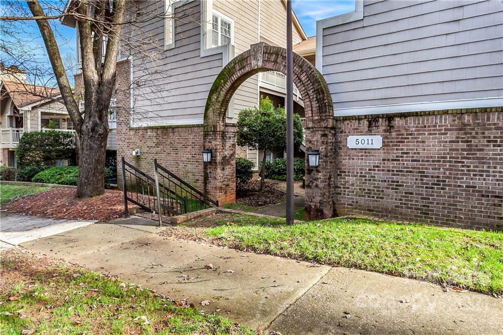 5011 Sharon Road, Unit E Charlotte, NC 28210 - Photo 18 of 19 a view of house with wooden fence