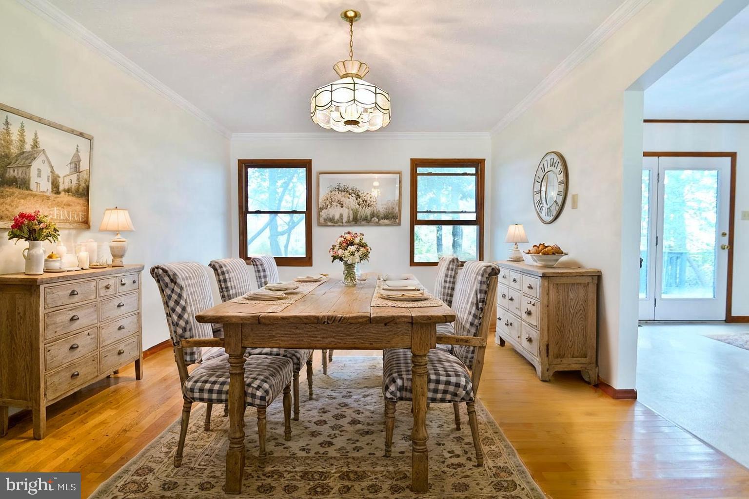 2784 Ridge Hollow Road Edinburg, VA 22824 - Photo 19 of 60 a view of a dining room with furniture window and wooden floor