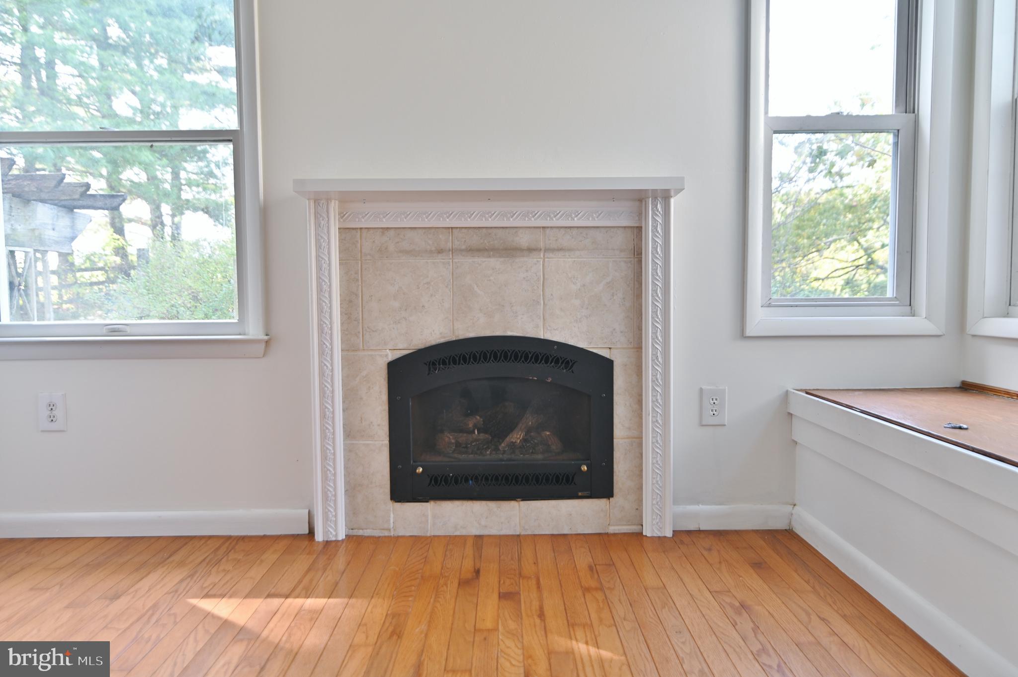 2784 Ridge Hollow Road Edinburg, VA 22824 - Photo 26 of 60 an empty room with windows and fireplace