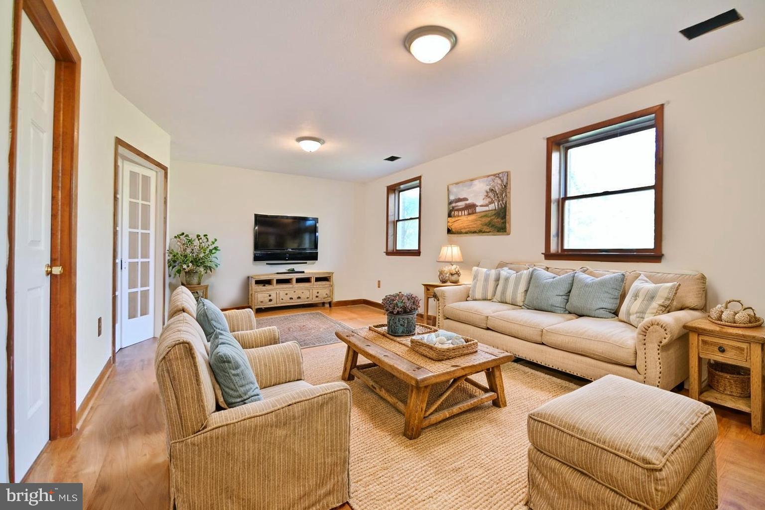 2784 Ridge Hollow Road Edinburg, VA 22824 - Photo 42 of 60 a living room with furniture and a flat screen tv
