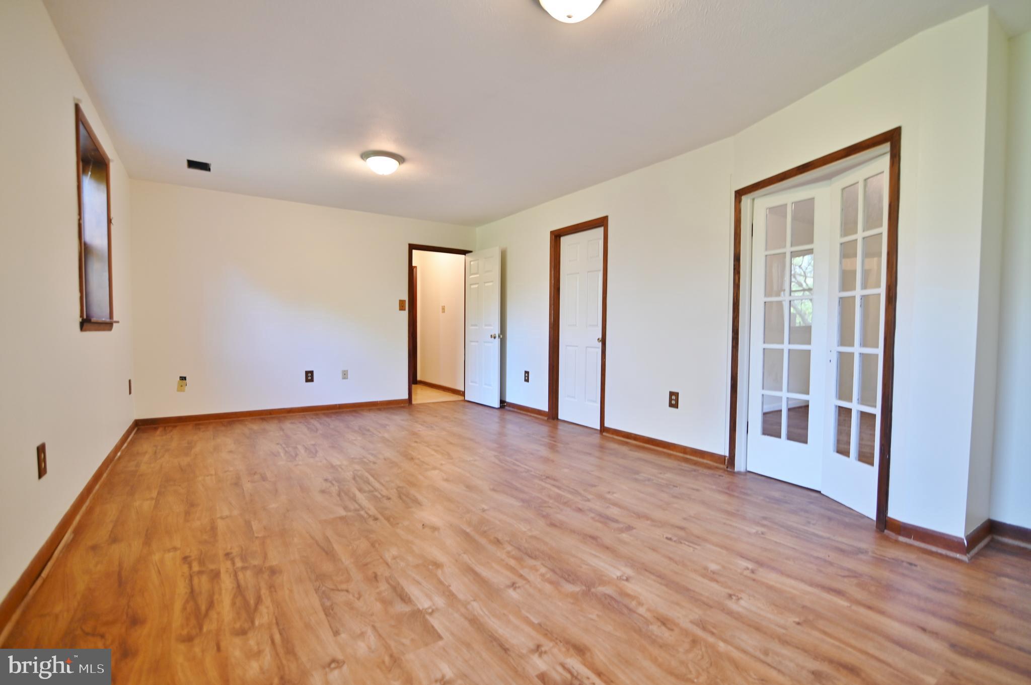 2784 Ridge Hollow Road Edinburg, VA 22824 - Photo 44 of 60 a view of an empty room with wooden floor