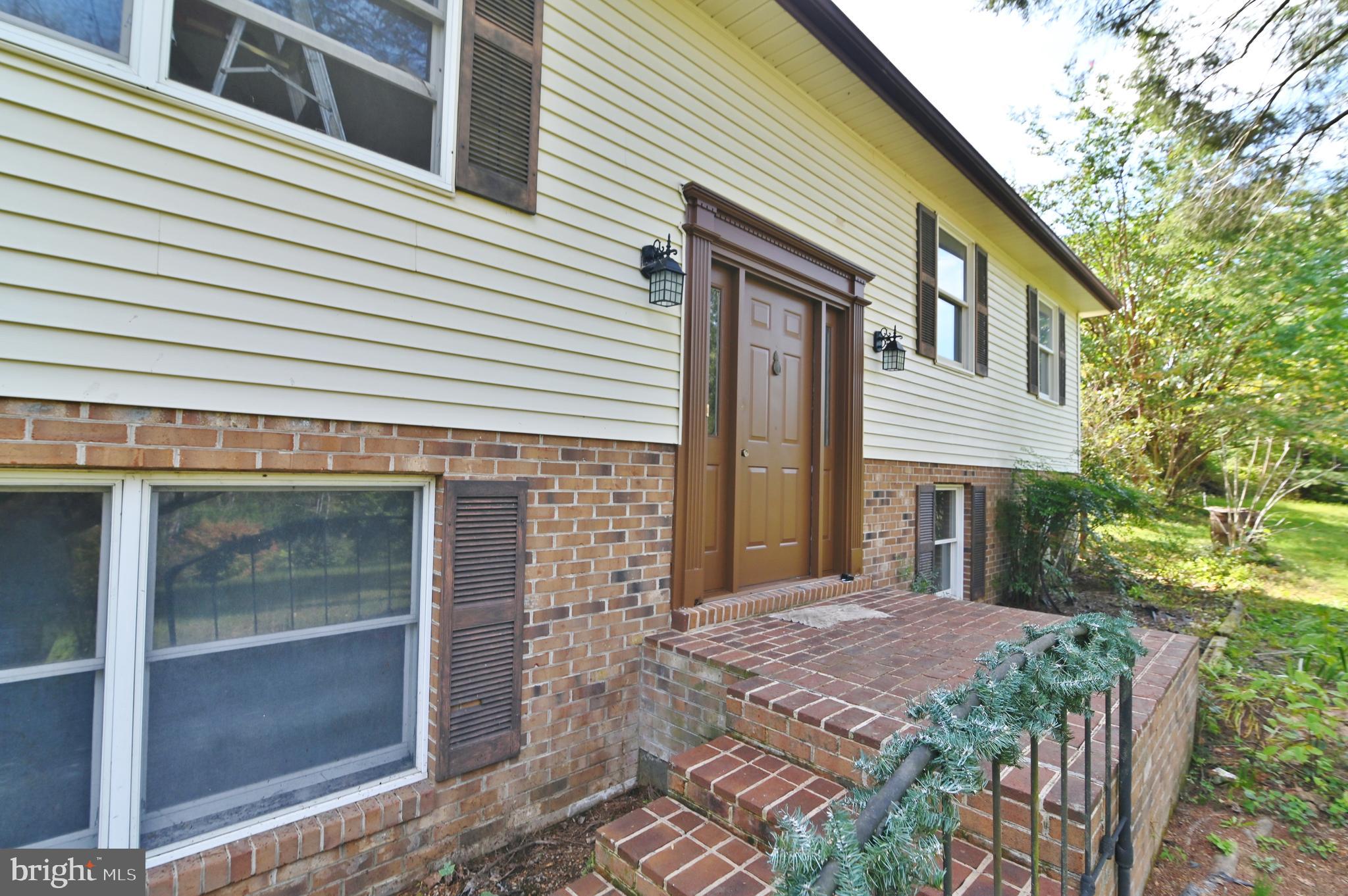 2784 Ridge Hollow Road Edinburg, VA 22824 - Photo 5 of 60 a view of a house with a yard