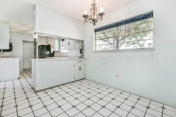 a view of a kitchen with a sink cabinets and a window