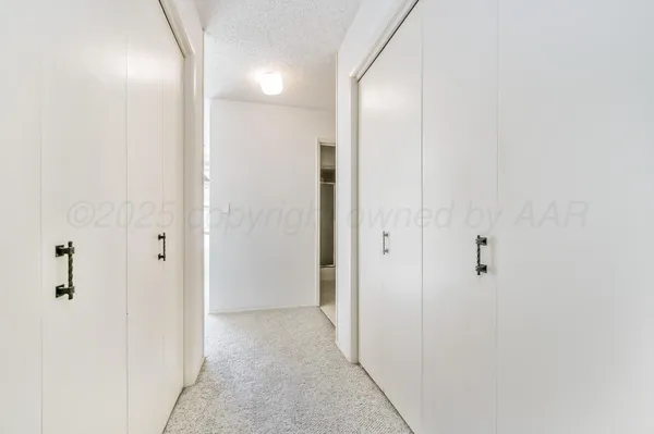 a view of a bathroom from a hallway