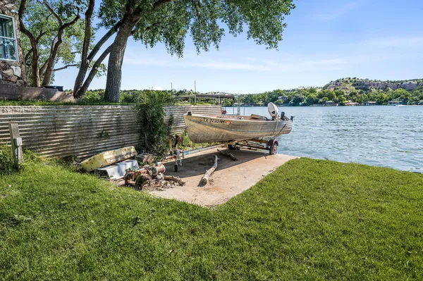 a view of a lake with a yard and lake view