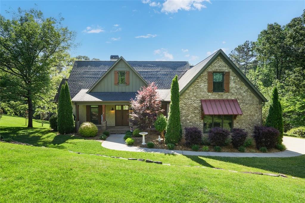 4055 Lacey Drive Cumming, GA 30041 - Photo 1 of 1 a front view of a house with a yard