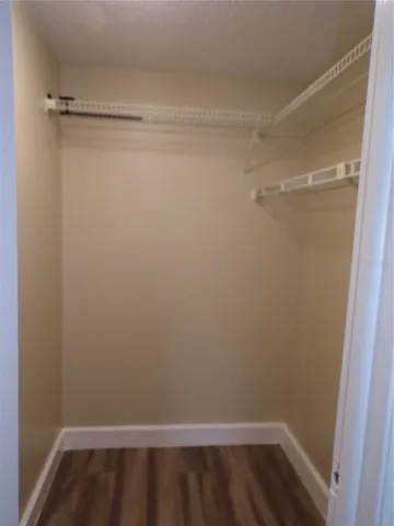 a view of an empty walk in closet