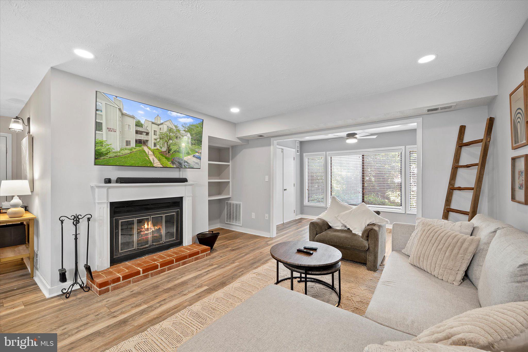 2221 Hunter's Run Drive Reston, VA 20191 - Photo 11 of 25 a living room with furniture and a fireplace