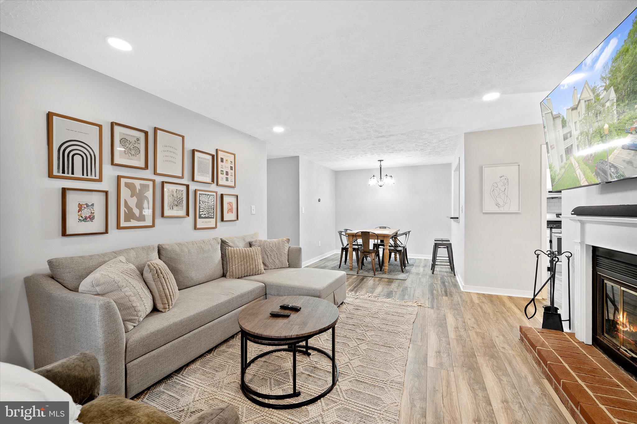 2221 Hunter's Run Drive Reston, VA 20191 - Photo 12 of 25 a living room with furniture and a fireplace
