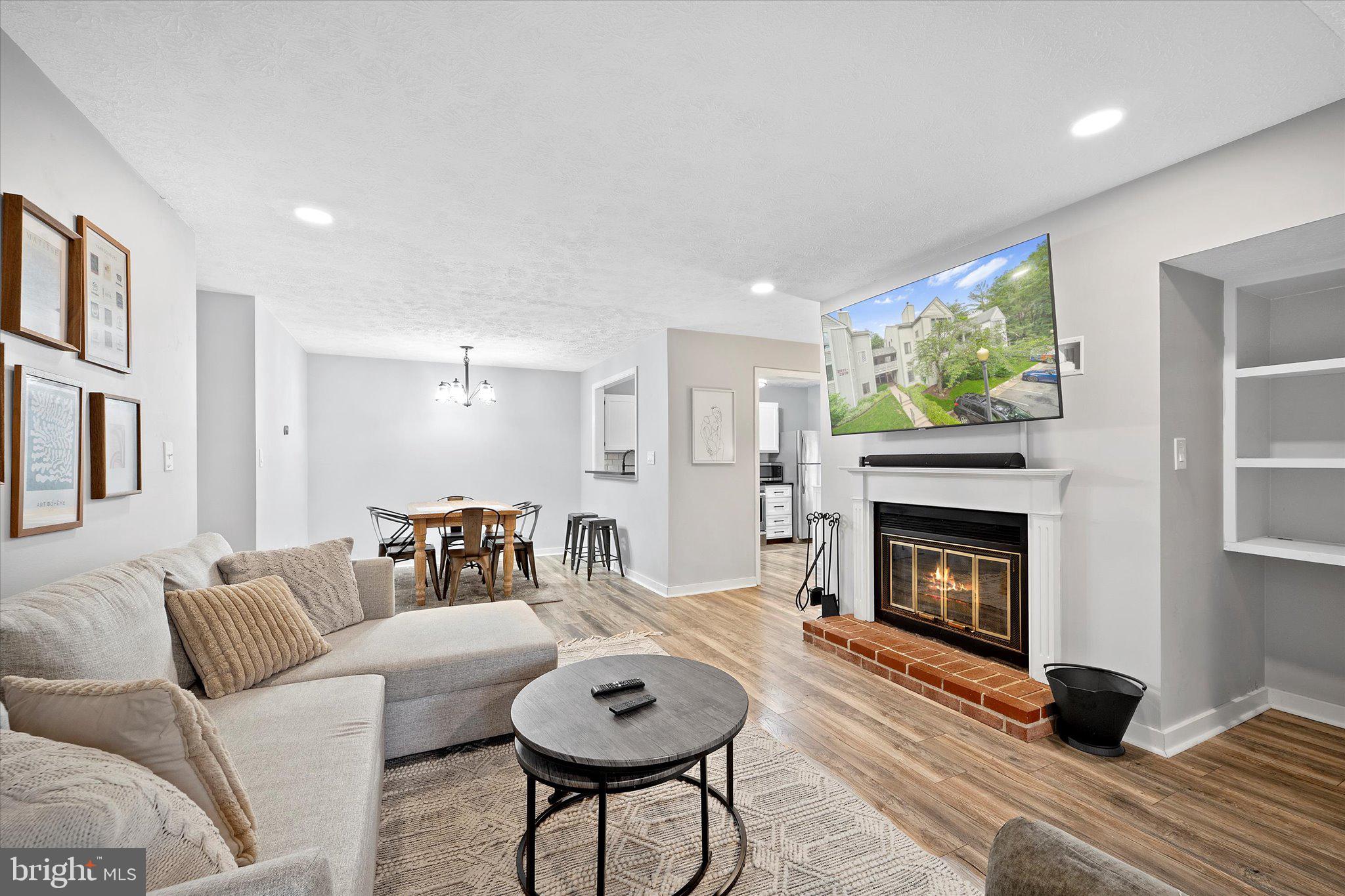 2221 Hunter's Run Drive Reston, VA 20191 - Photo 13 of 25 a living room with furniture and a fireplace
