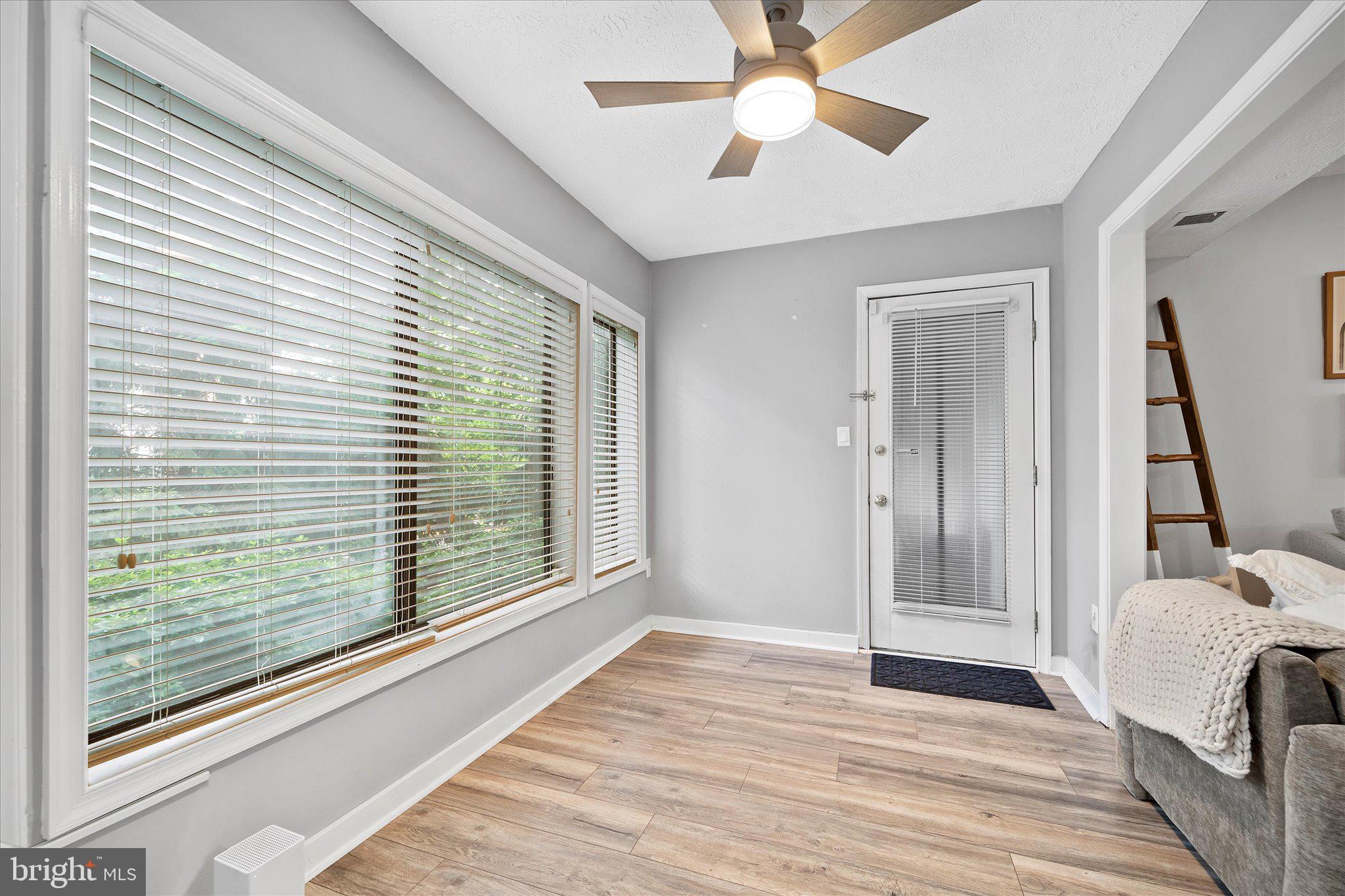 2221 Hunter's Run Drive Reston, VA 20191 - Photo 15 of 25 a view of a bedroom with a large bed and wooden floor