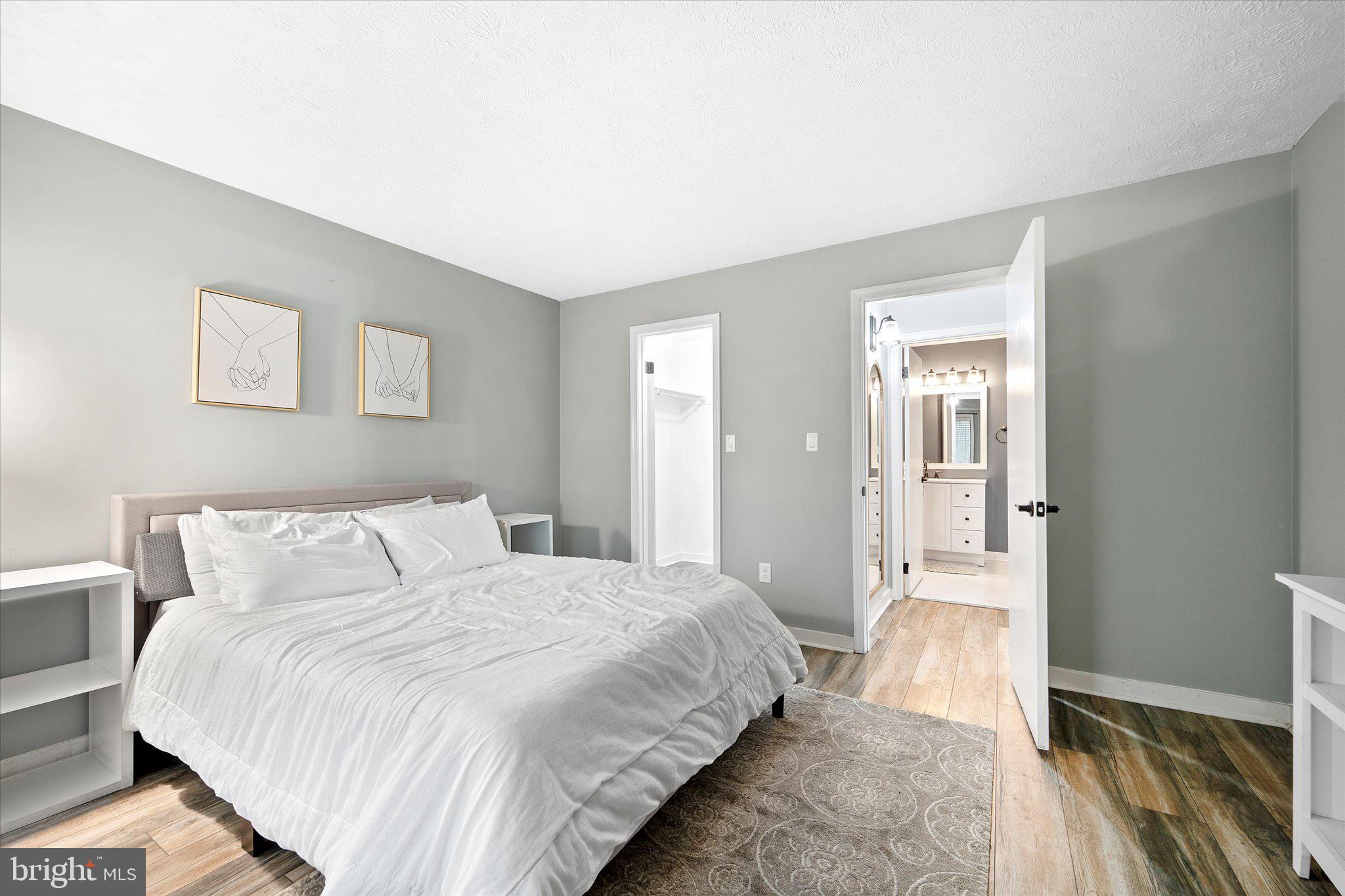 2221 Hunter's Run Drive Reston, VA 20191 - Photo 18 of 25 a bedroom with a bed and a walk in closet