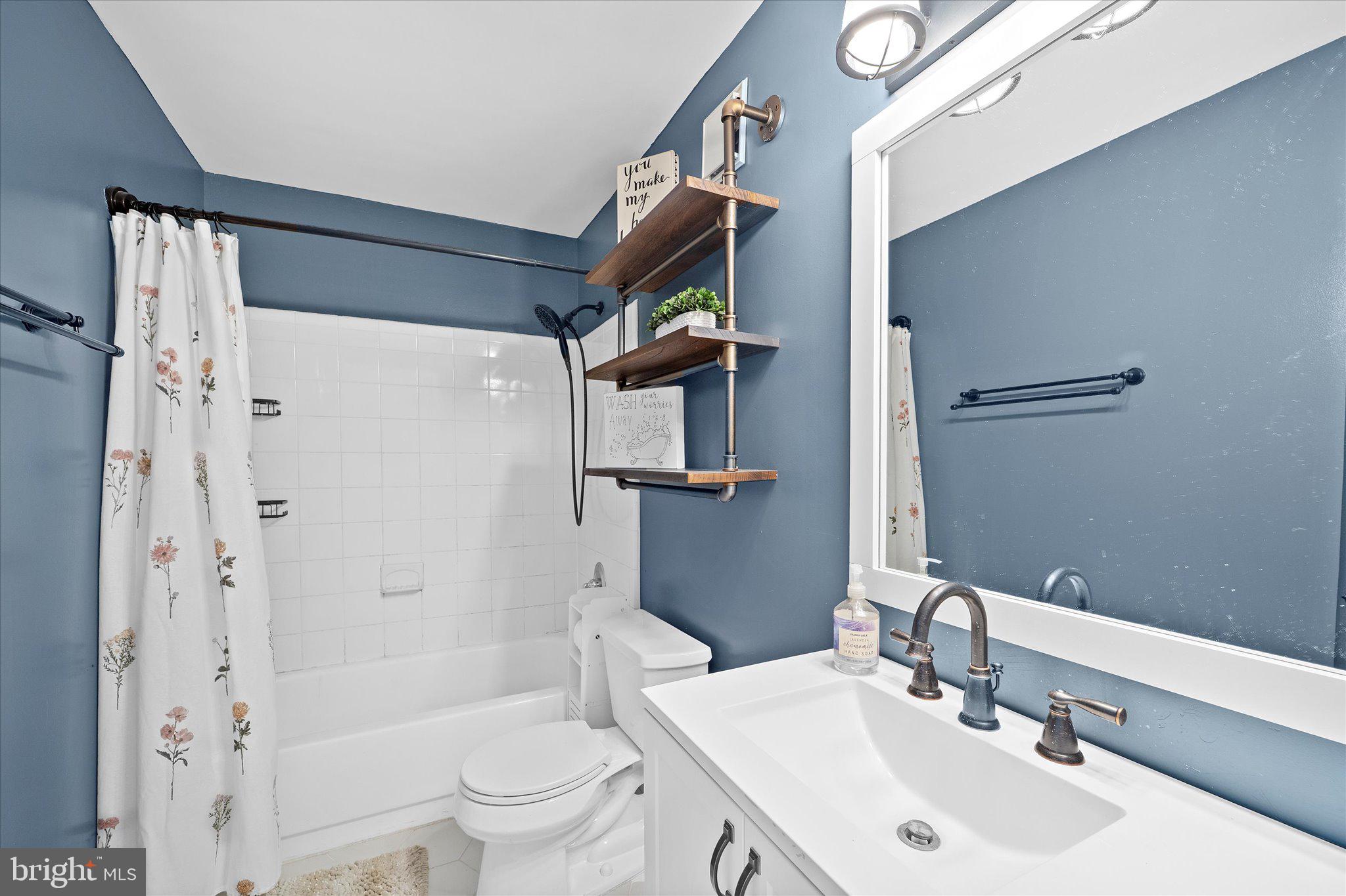 2221 Hunter's Run Drive Reston, VA 20191 - Photo 19 of 25 a bathroom with a sink toilet and shower