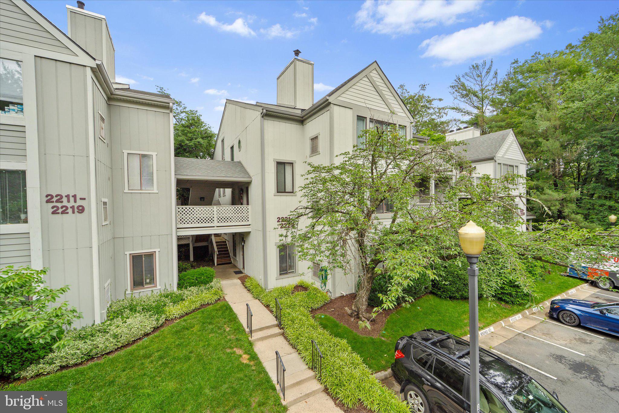 2221 Hunter's Run Drive Reston, VA 20191 - Photo 2 of 25 a front view of a house with garden