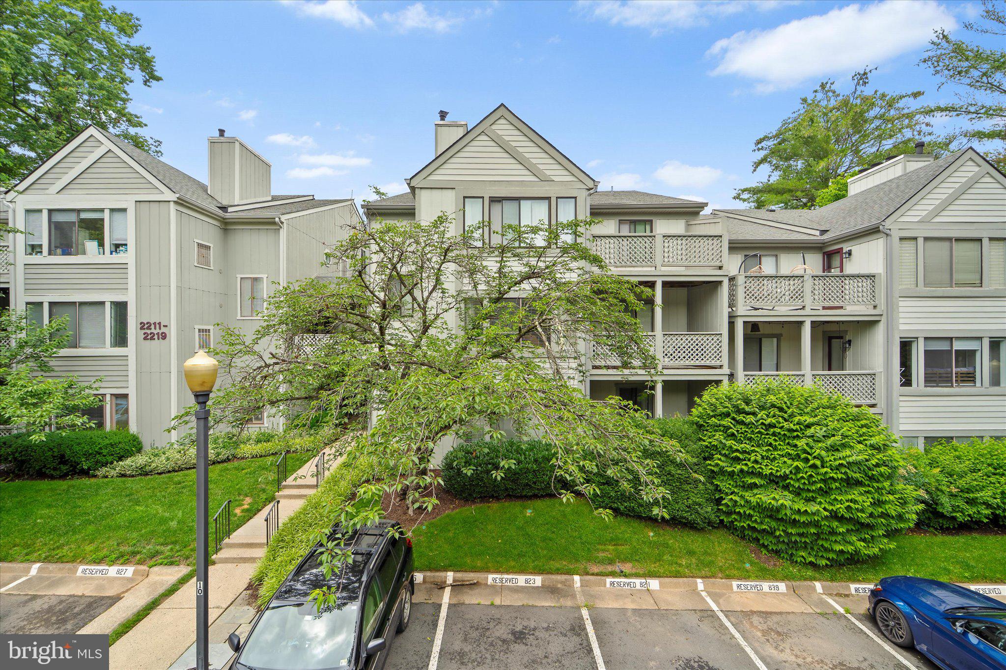 2221 Hunter's Run Drive Reston, VA 20191 - Photo 3 of 25 a front view of a house with a garden