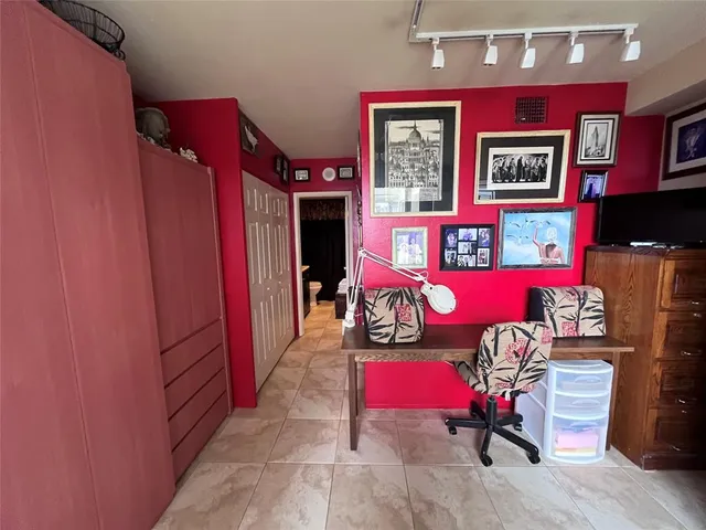 a view of a swimming pool with outdoor seating and plants