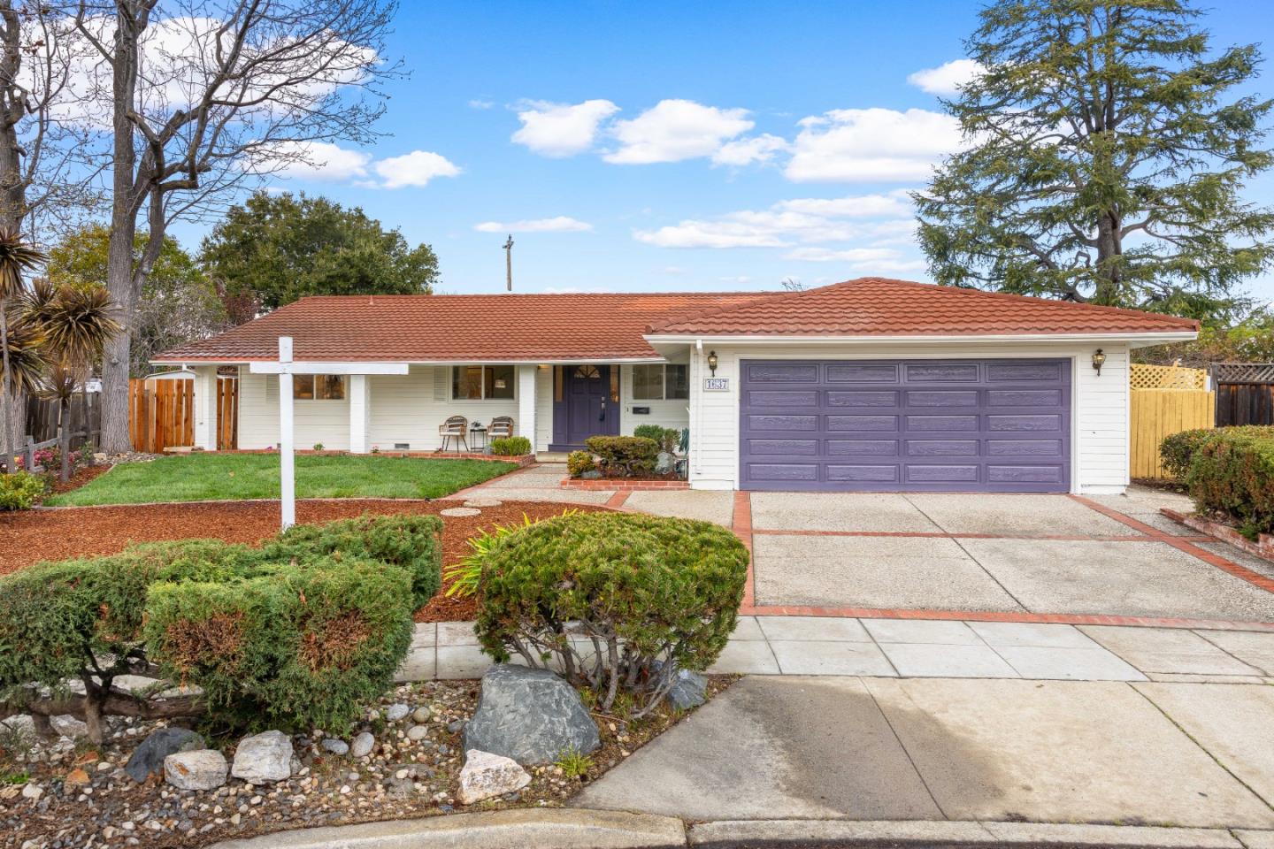 1637 Kitchener Drive Sunnyvale, CA 94087 - Photo 1 of 57 a front view of a house with a garden