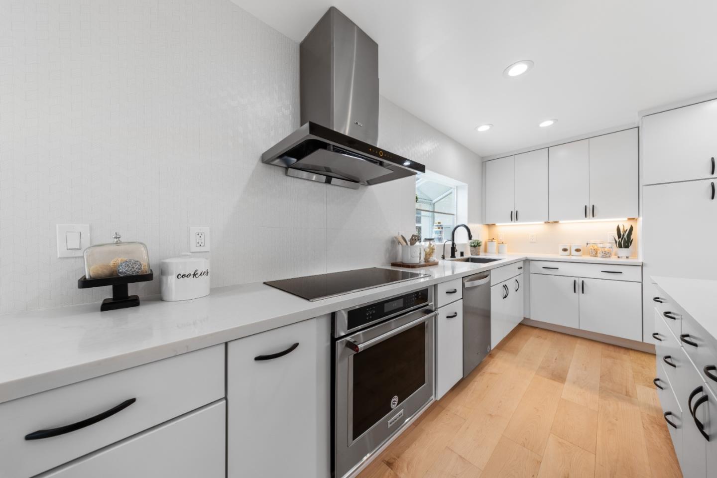 1637 Kitchener Drive Sunnyvale, CA 94087 - Photo 16 of 57 a kitchen with a stove and a sink