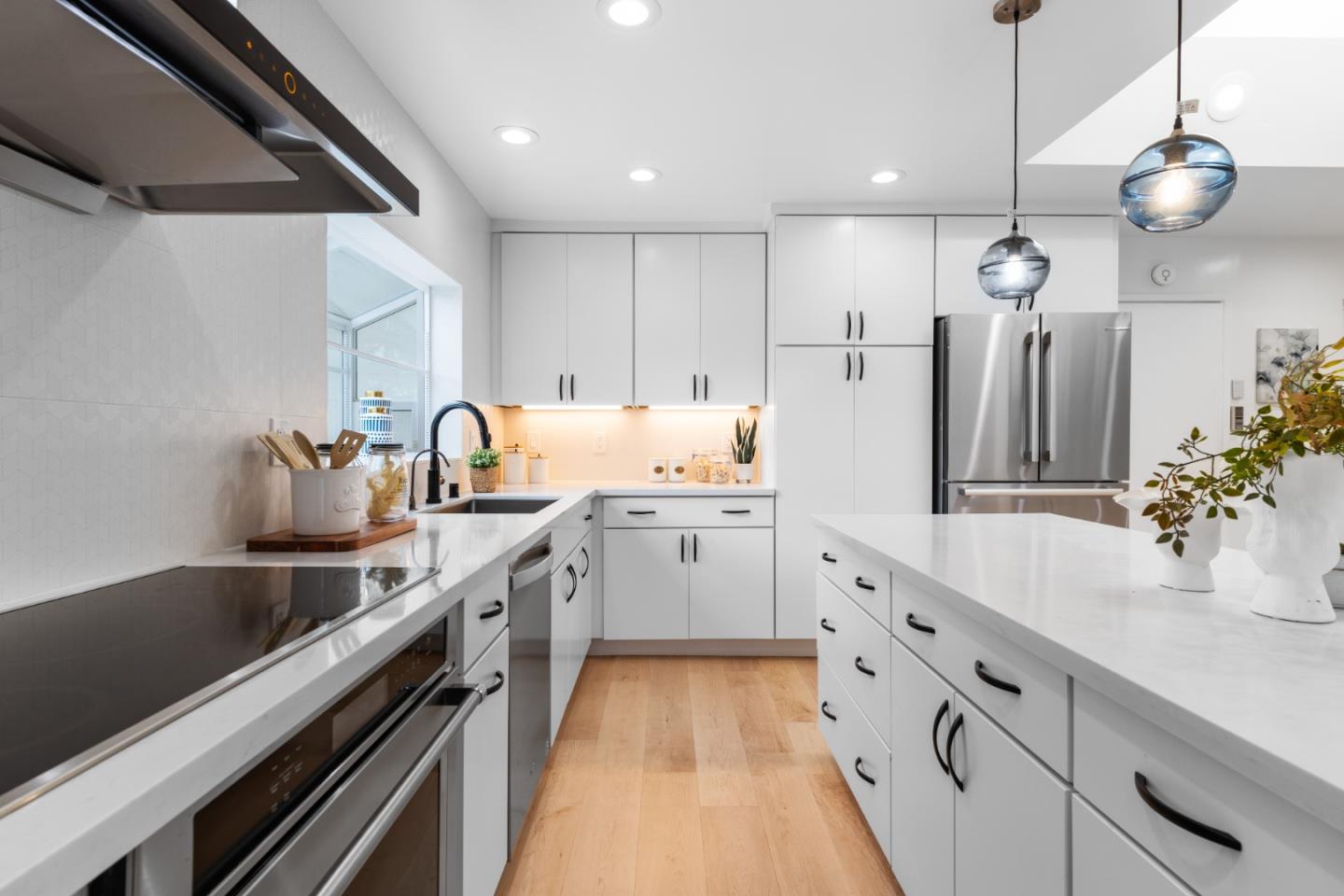 1637 Kitchener Drive Sunnyvale, CA 94087 - Photo 17 of 57 a kitchen with white cabinets sink and stainless steel appliances