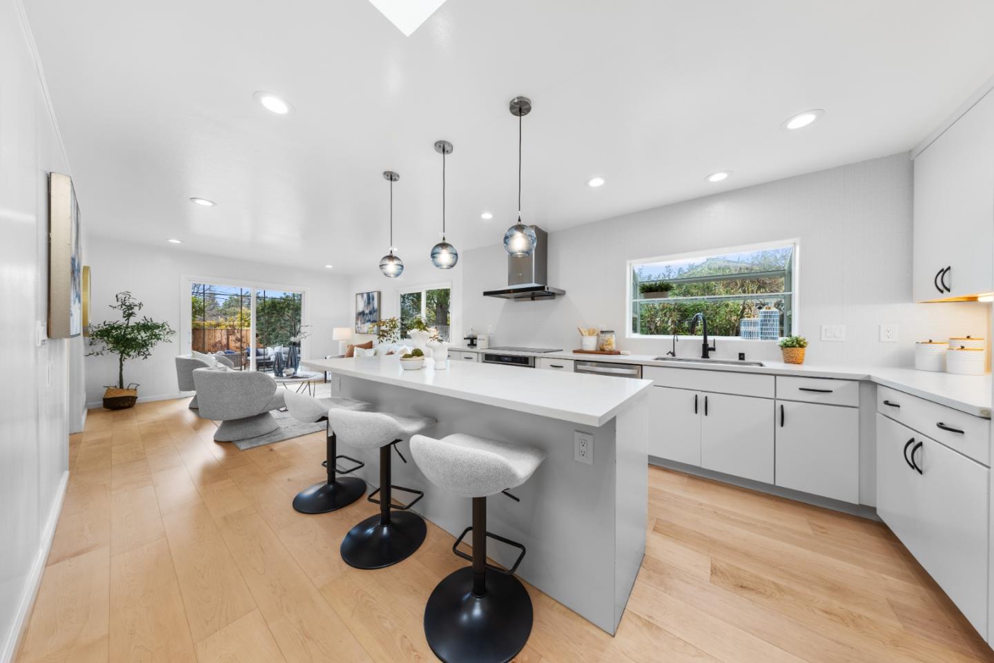 1637 Kitchener Drive Sunnyvale, CA 94087 - Photo 20 of 57 a kitchen with sink cabinets and living room view