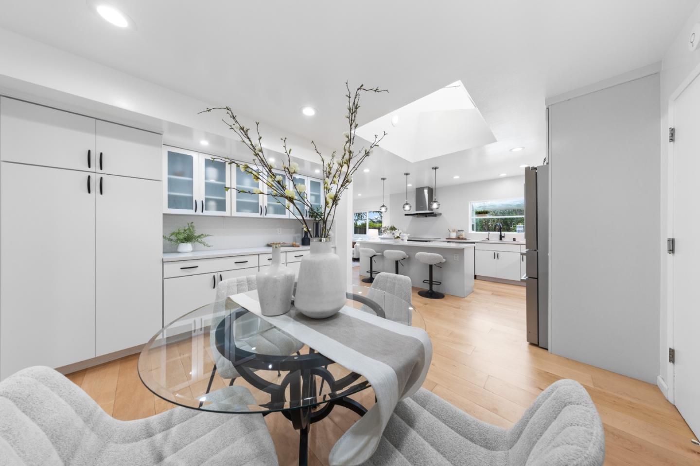 1637 Kitchener Drive Sunnyvale, CA 94087 - Photo 24 of 57 a living room with furniture a rug and kitchen view