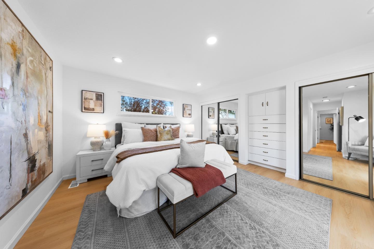 1637 Kitchener Drive Sunnyvale, CA 94087 - Photo 26 of 57 a spacious bedroom with a large bed and a couch