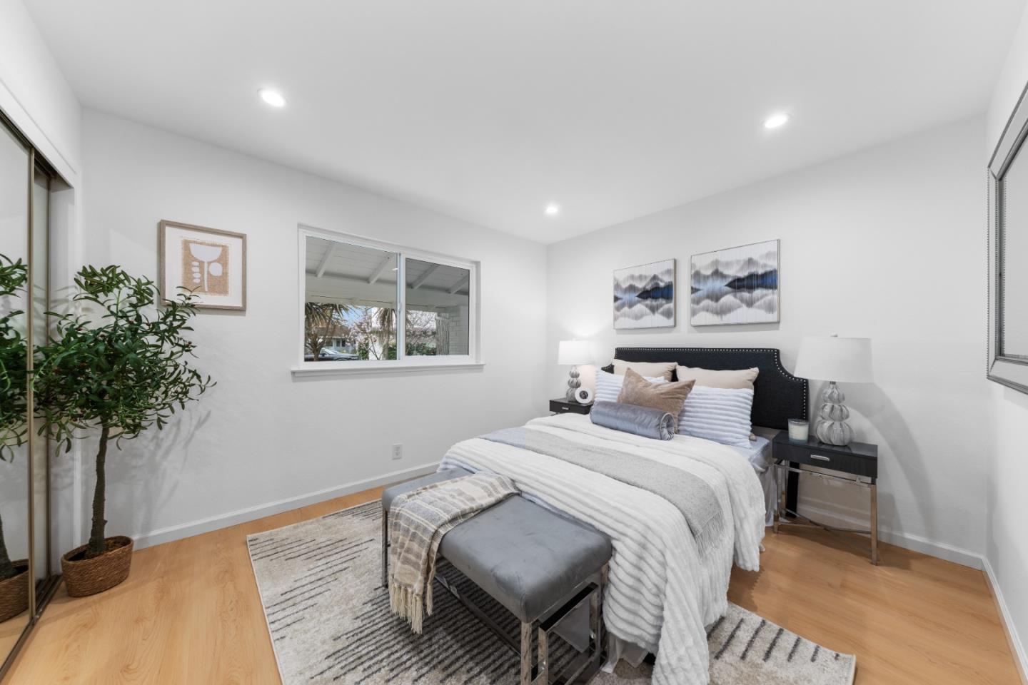 1637 Kitchener Drive Sunnyvale, CA 94087 - Photo 31 of 57 a bedroom with a bed and a potted plant