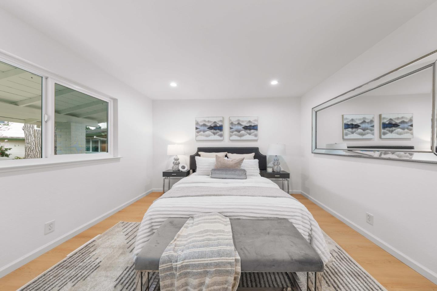 1637 Kitchener Drive Sunnyvale, CA 94087 - Photo 32 of 57 a spacious bedroom with a large bed and a window