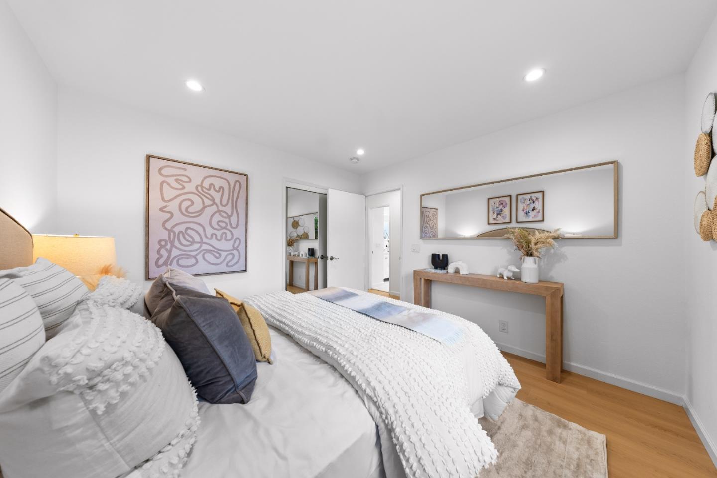 1637 Kitchener Drive Sunnyvale, CA 94087 - Photo 36 of 57 a bedroom with a large bed and a painting on the wall