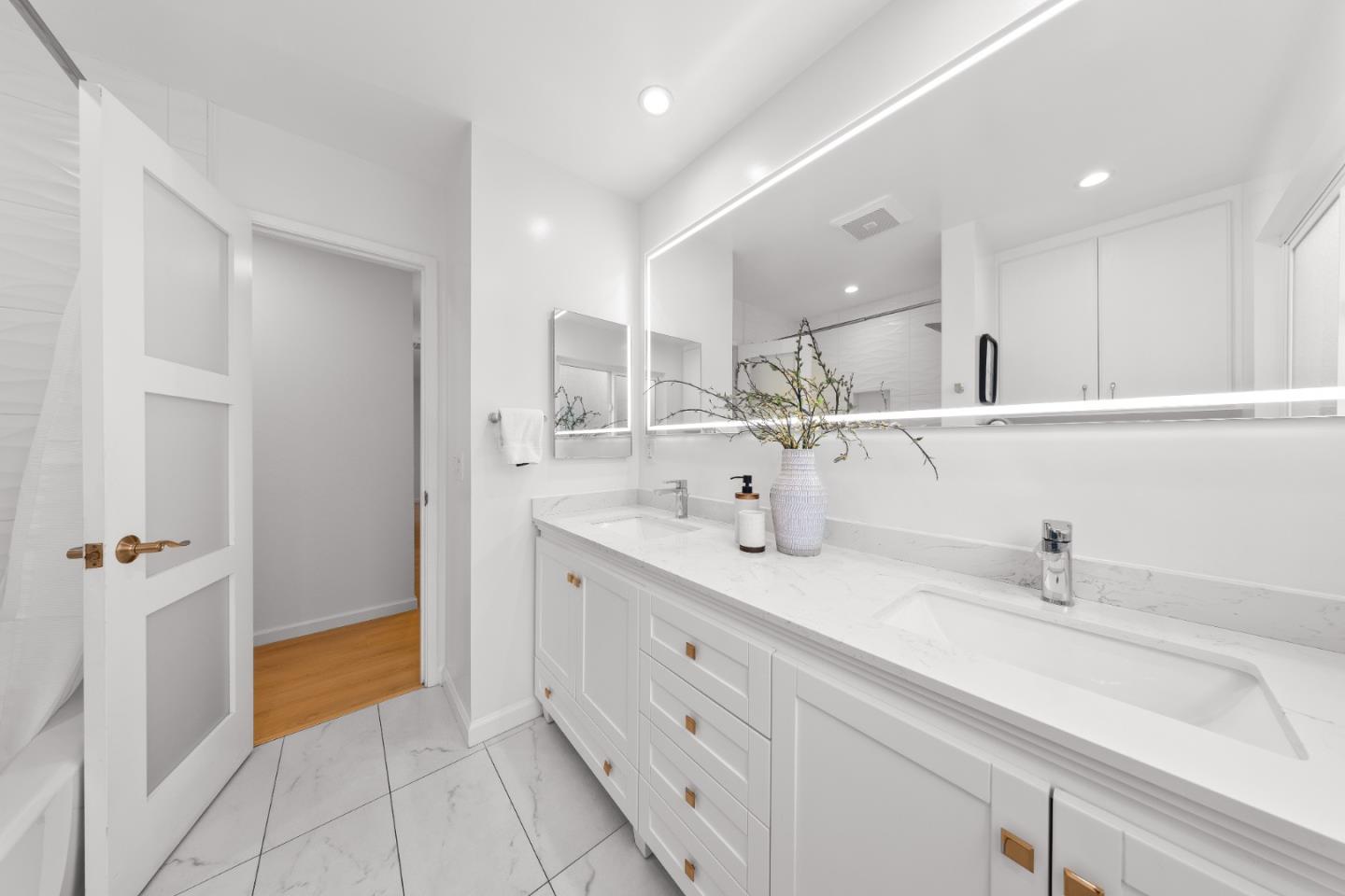 1637 Kitchener Drive Sunnyvale, CA 94087 - Photo 40 of 57 a bathroom with a double vanity sink mirror and shower