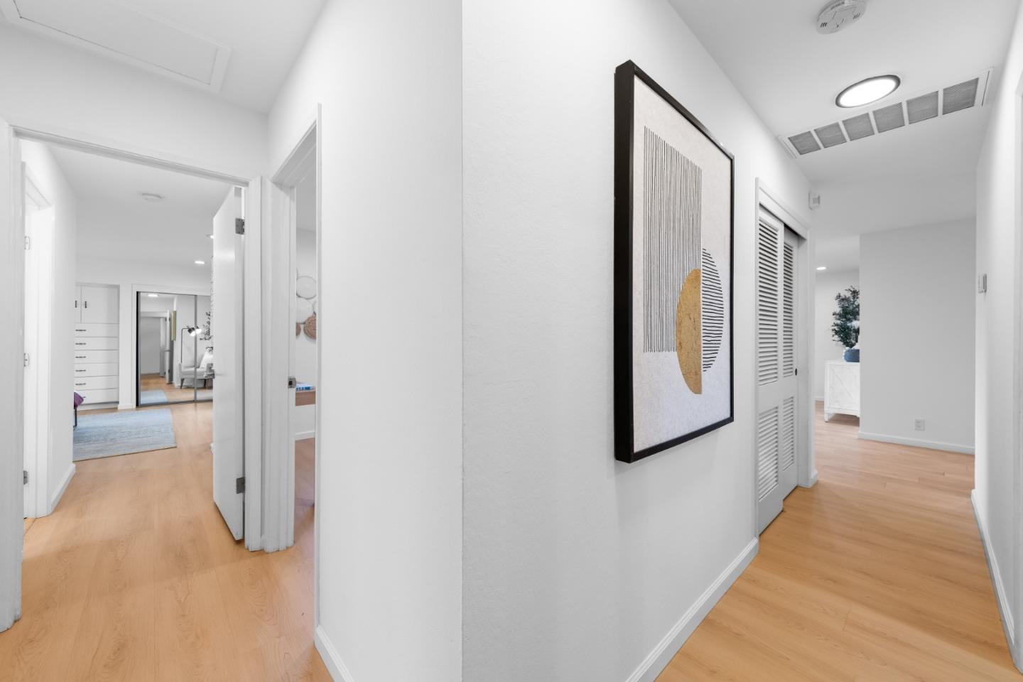 1637 Kitchener Drive Sunnyvale, CA 94087 - Photo 42 of 57 a hallway with wooden floor and mirror