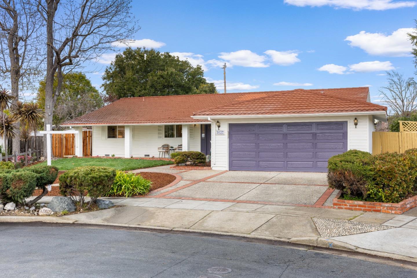 1637 Kitchener Drive Sunnyvale, CA 94087 - Photo 6 of 57 a front view of a house with a yard and outdoor seating
