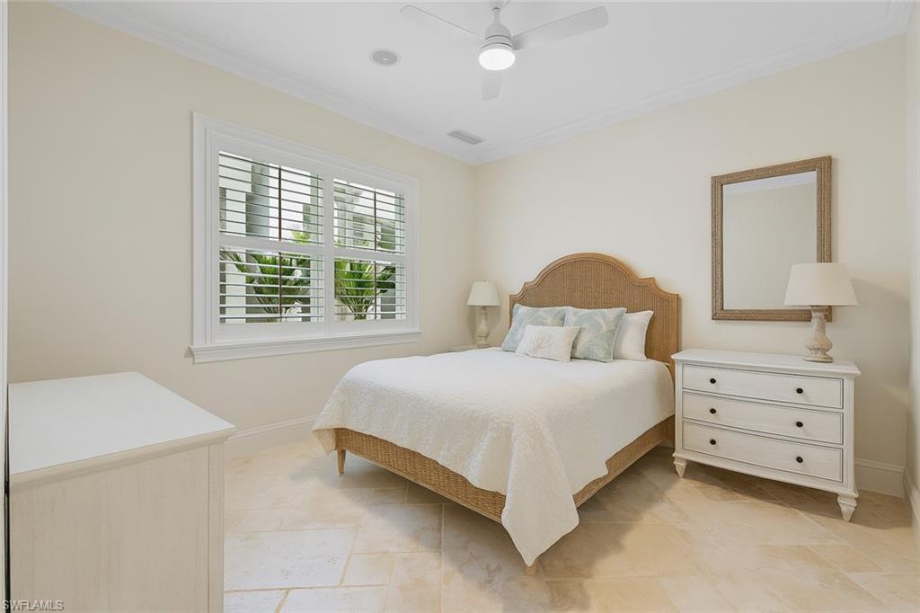 1001 10th Avenue South, Unit C1 Naples, FL 34102 - Photo 15 of 38 a bedroom with a bed and a window