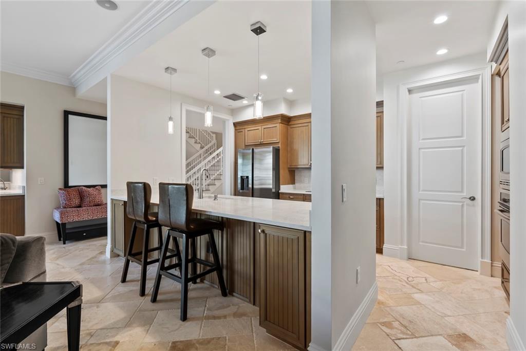 1001 10th Avenue South, Unit C1 Naples, FL 34102 - Photo 21 of 38 a view of kitchen with dining area