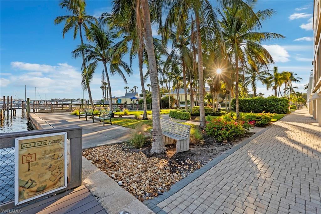 1001 10th Avenue South, Unit C1 Naples, FL 34102 - Photo 26 of 38 a view of a yard with palm trees