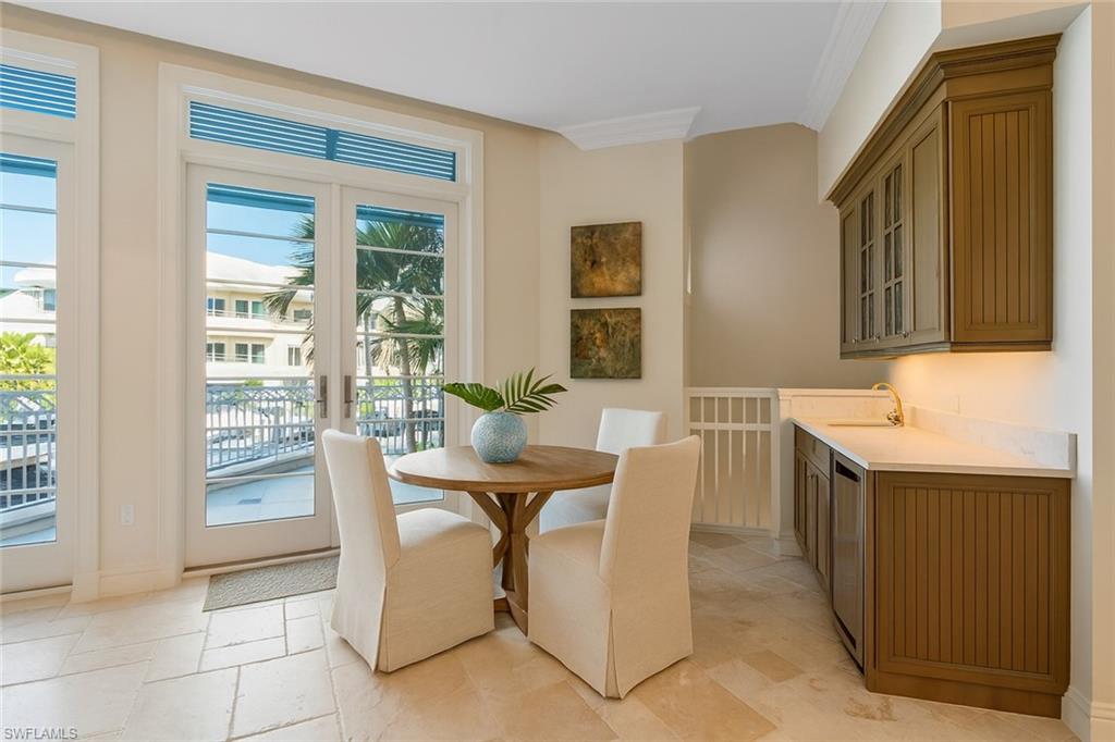 1001 10th Avenue South, Unit C1 Naples, FL 34102 - Photo 6 of 38 a dining room with furniture and window
