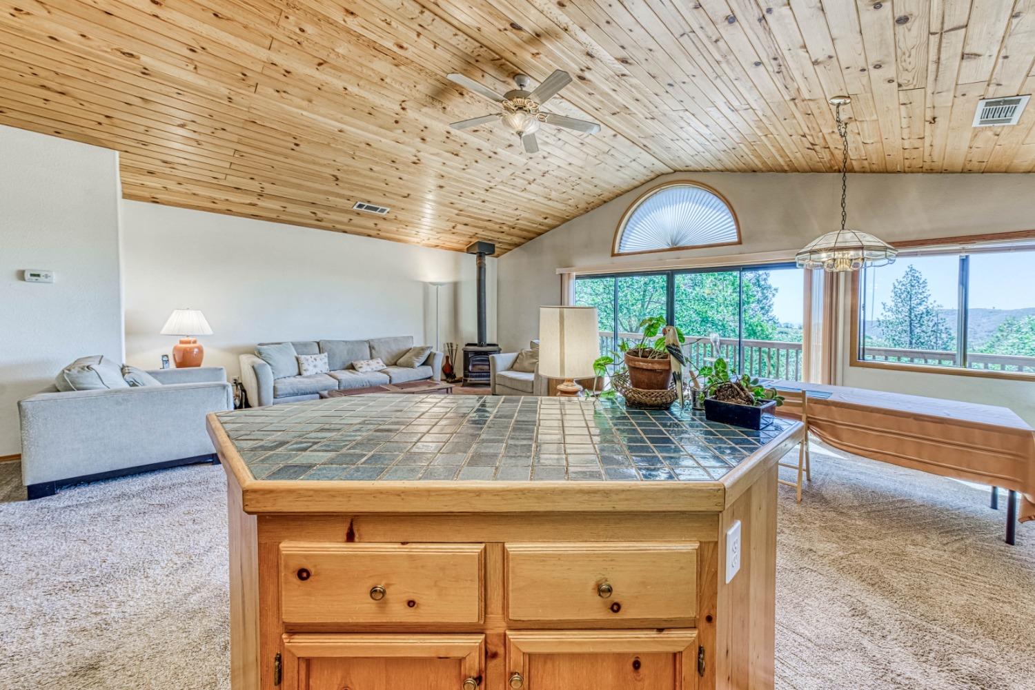 34075 Shaver Springs Road Auberry, CA 93602 - Photo 15 of 41 a view of kitchen with granite countertop window and outdoor seating