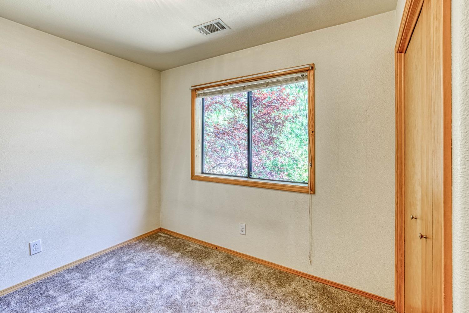 34075 Shaver Springs Road Auberry, CA 93602 - Photo 16 of 41 an empty room with a window