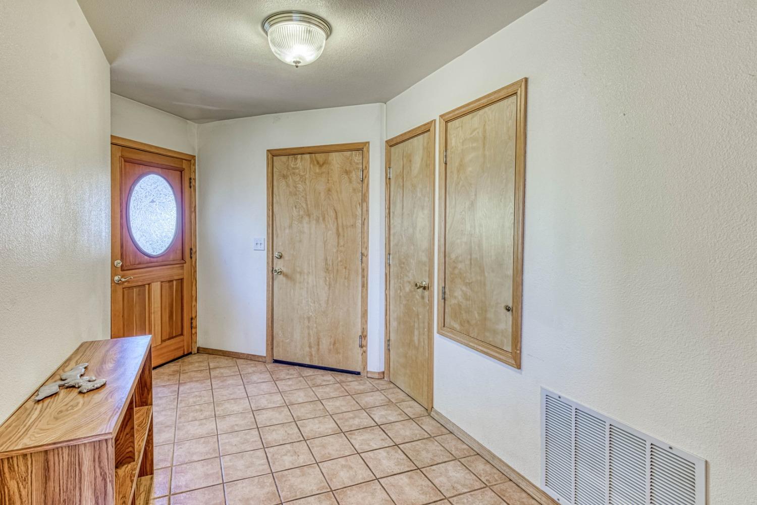 34075 Shaver Springs Road Auberry, CA 93602 - Photo 20 of 41 a view of an entryway with wooden floor