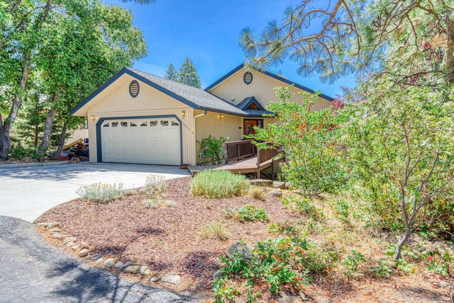 34075 Shaver Springs Road Auberry, CA 93602 - Photo 2 of 41 a view of a house with a yard and large tree