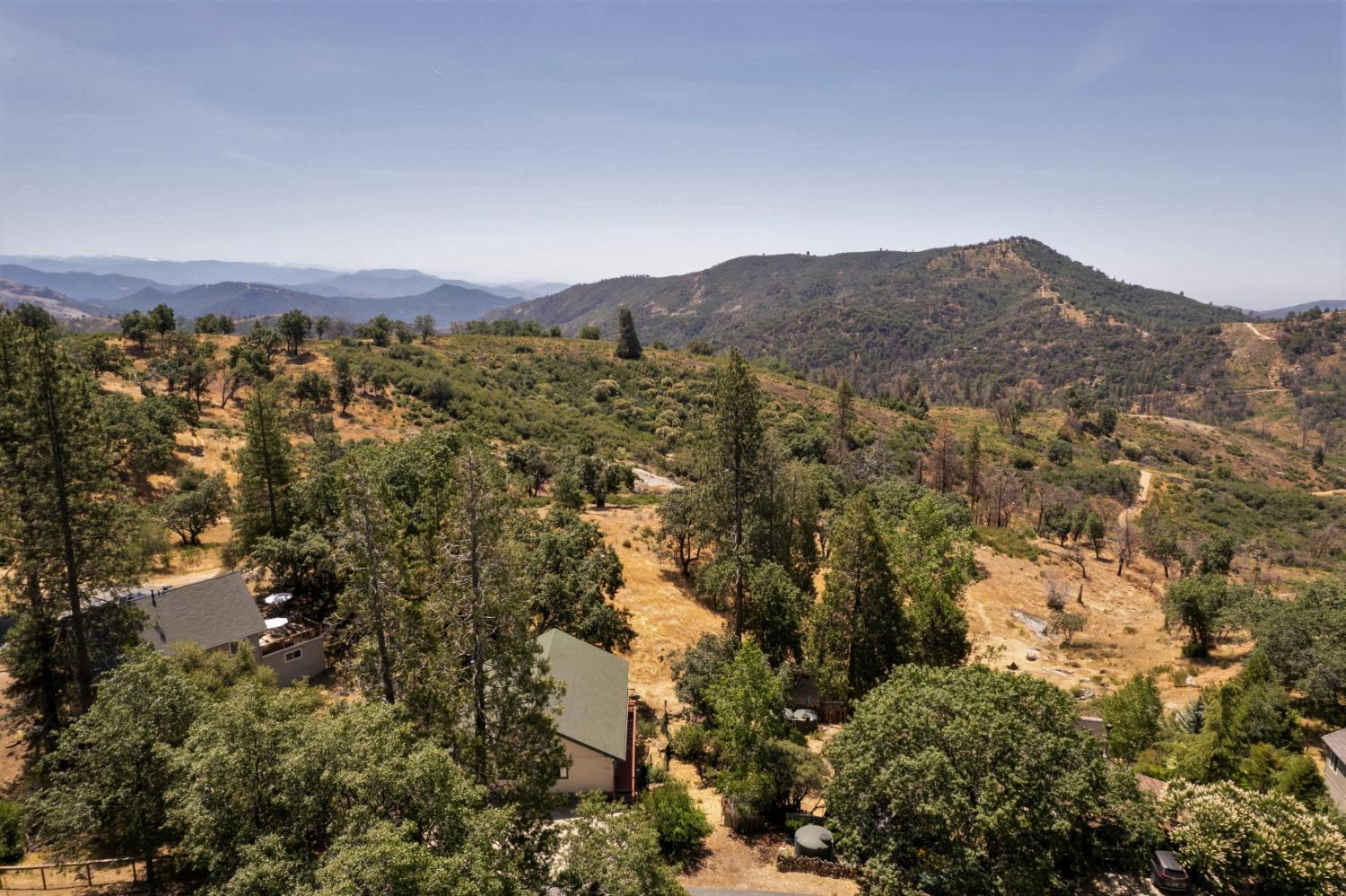 34075 Shaver Springs Road Auberry, CA 93602 - Photo 32 of 41 an aerial view of houses covered in trees
