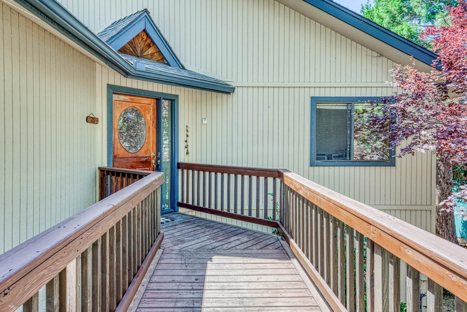 34075 Shaver Springs Road Auberry, CA 93602 - Photo 4 of 41 a view of a house with wooden fence