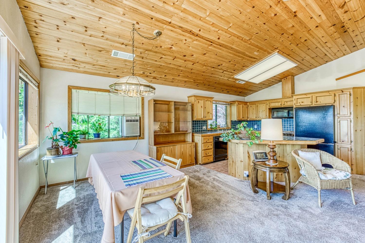 34075 Shaver Springs Road Auberry, CA 93602 - Photo 8 of 41 a room with dining table and chairs