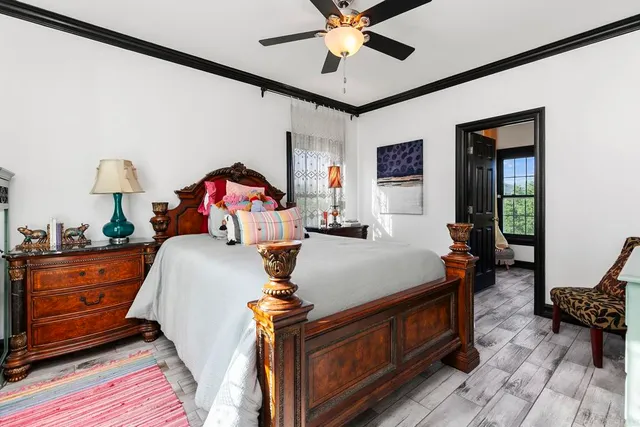 a bathroom with a granite countertop sink toilet a mirror a vanity and shower