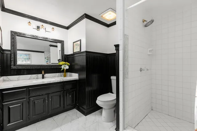 a bedroom with furniture and wooden floor