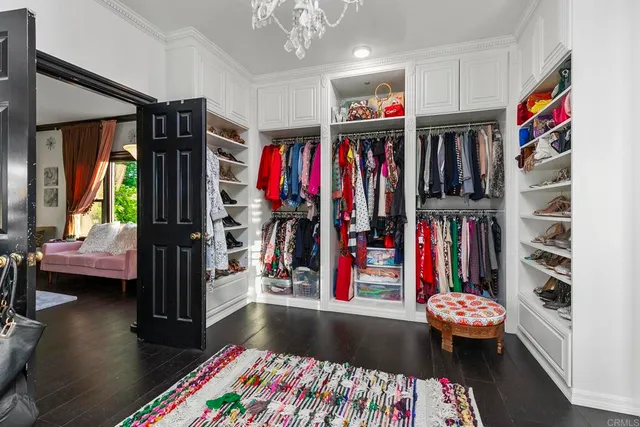 a view of a house with swimming pool and sitting area