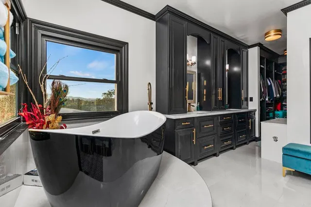 a view of a forest with mountains in the background