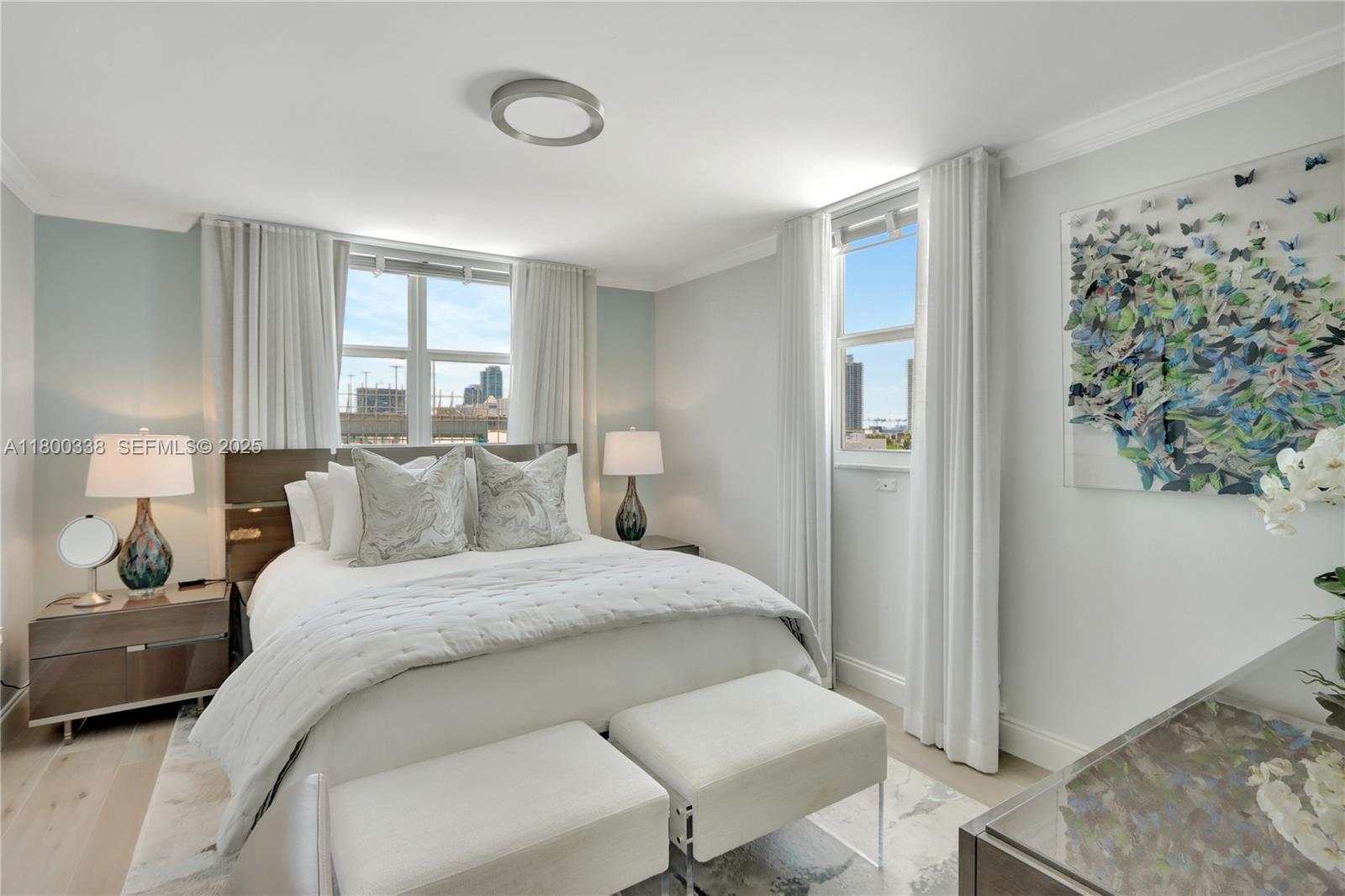 720 Collins Avenue, Unit PH1 Miami Beach, FL 33139 - Photo 13 of 27 a bedroom with a bed and a window
